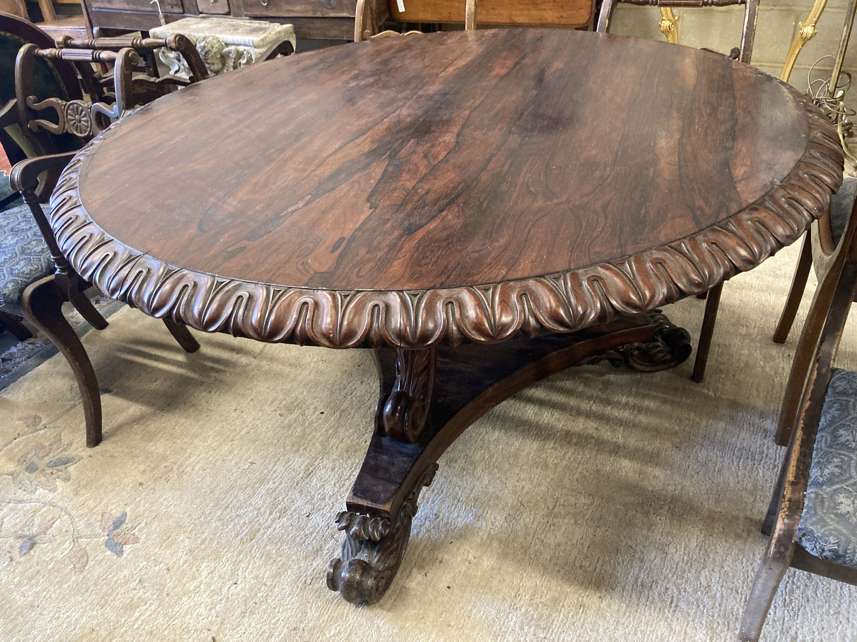 A George IV circular rosewood tilt top breakfast table, 138cm diameter, height 72cm